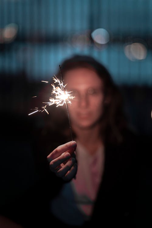 Free Shallow Focus Photography of Person Holding a Sparkler Stock Photo