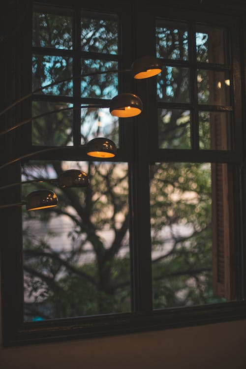 Free lighted lights near window Stock Photo
