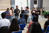 Women and Men at Gathering at Church