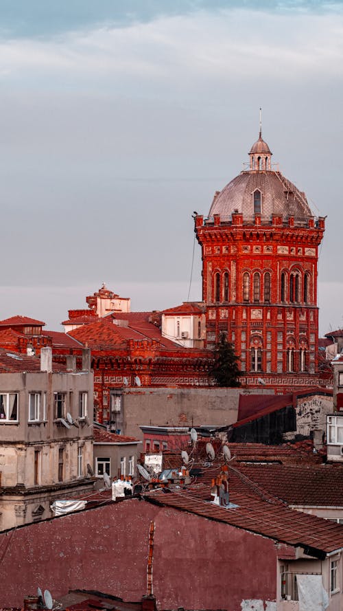 A red building with a dome on top of it