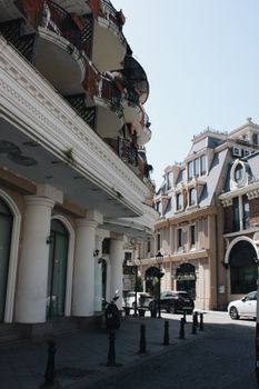 Elegant urban street with classic architecture and soft lighting in a serene cityscape.