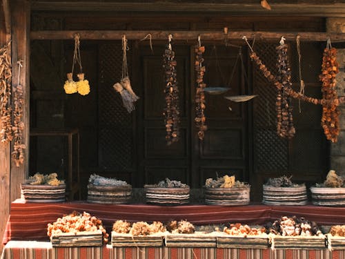 A shop with dried fruits and nuts hanging from the ceiling