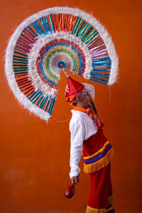 Man in Traditional Clothing with Hat with Plume