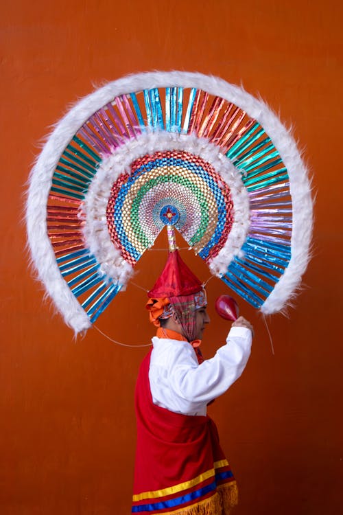 Man in Traditional Clothing with Hat and Plume