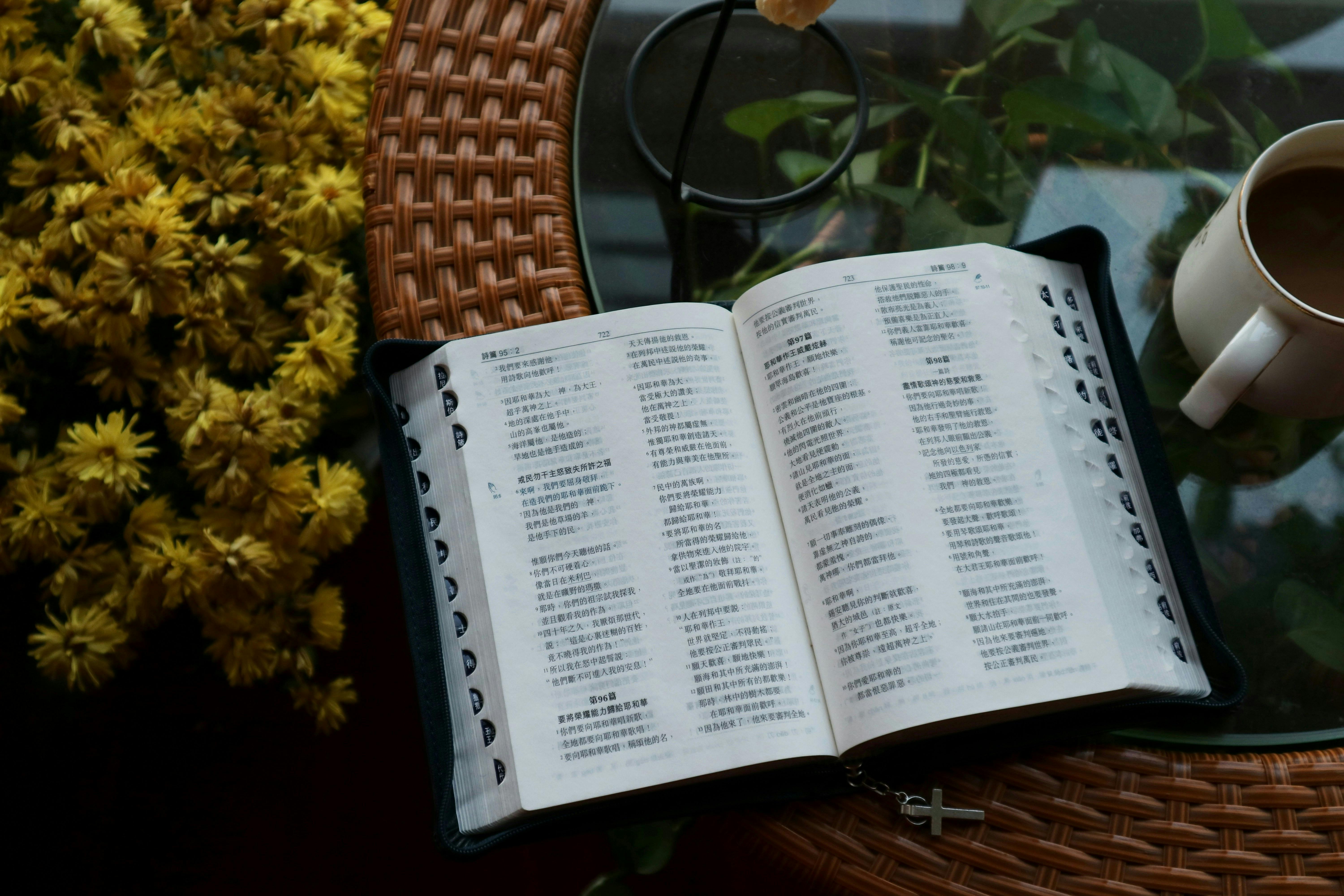 bible in chinese on table by mug