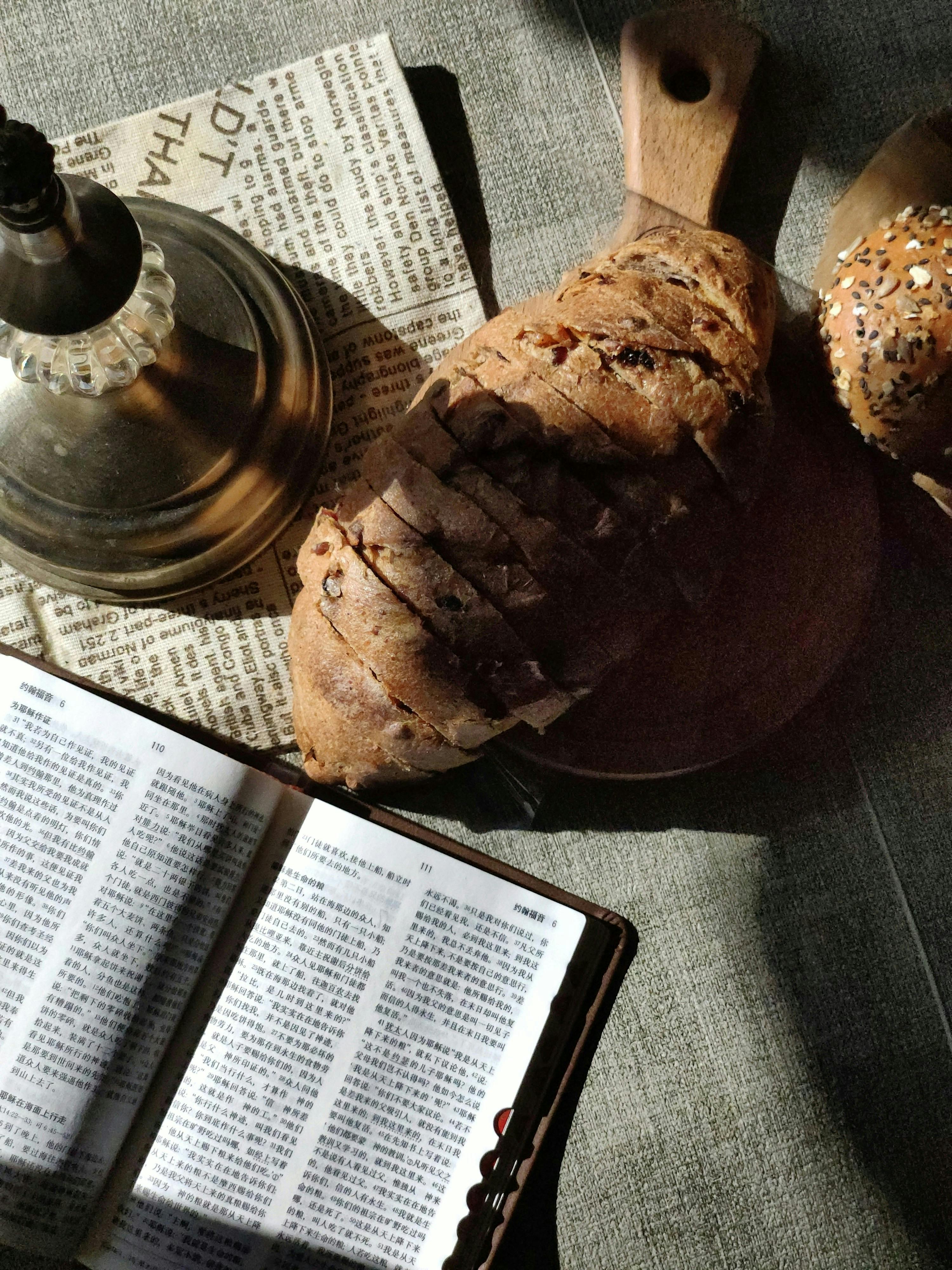 bible in chinese on table by bread