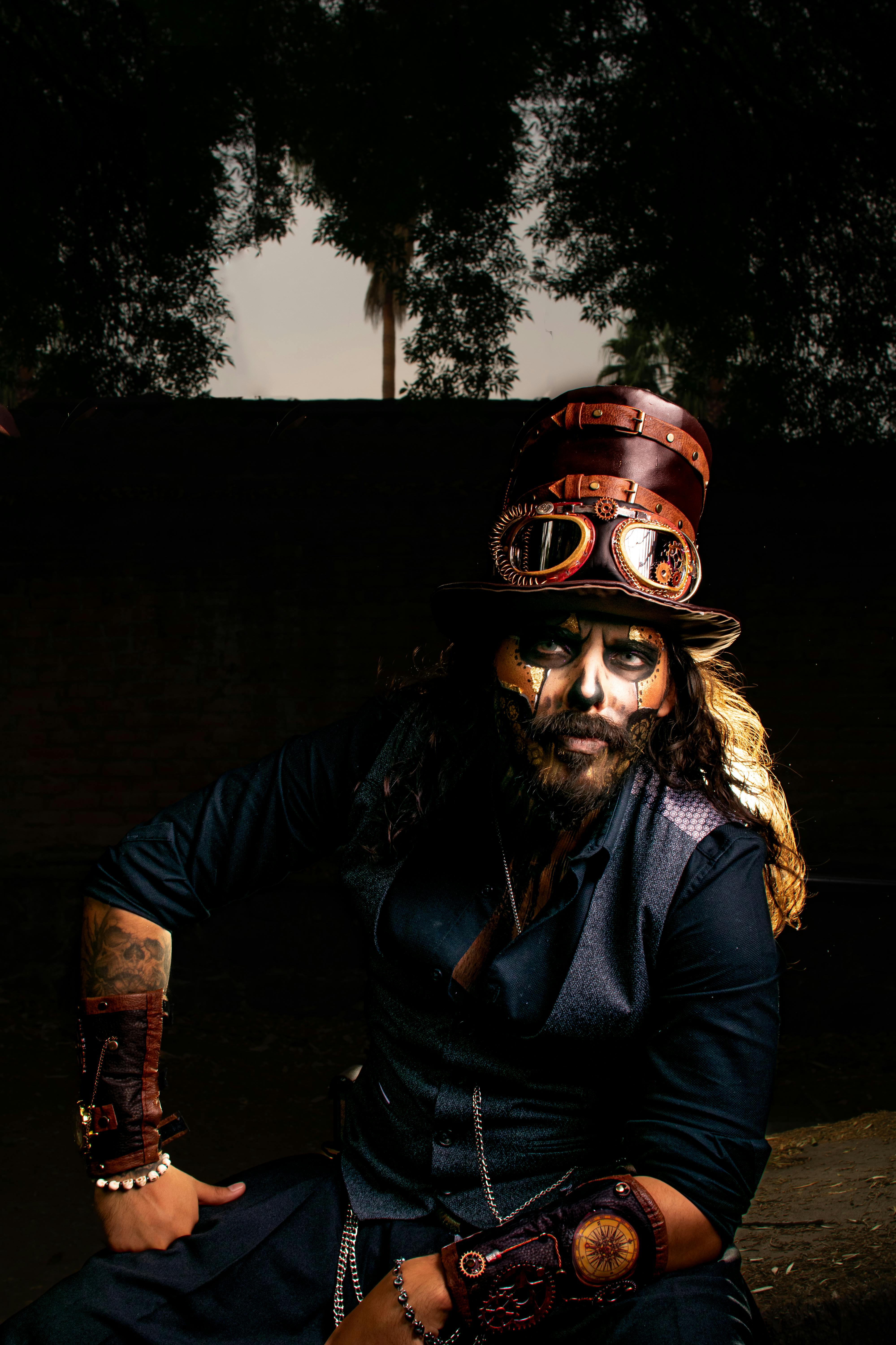Dramatic steampunk portrait of a man with elaborate makeup and accessories, set in Mexico City.