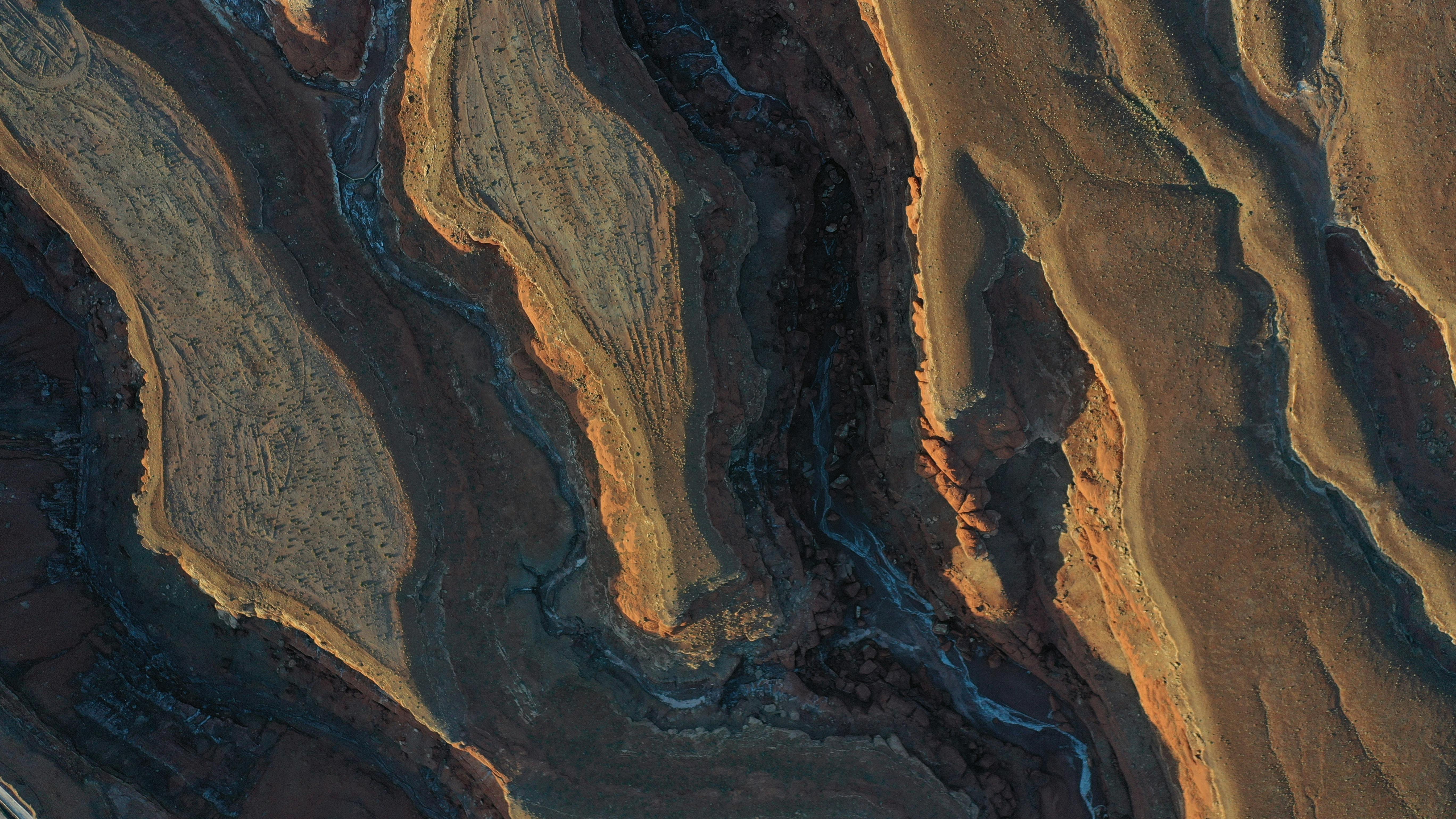 Stunning aerial capture of Moab's layered desert formations, showcasing natural beauty.