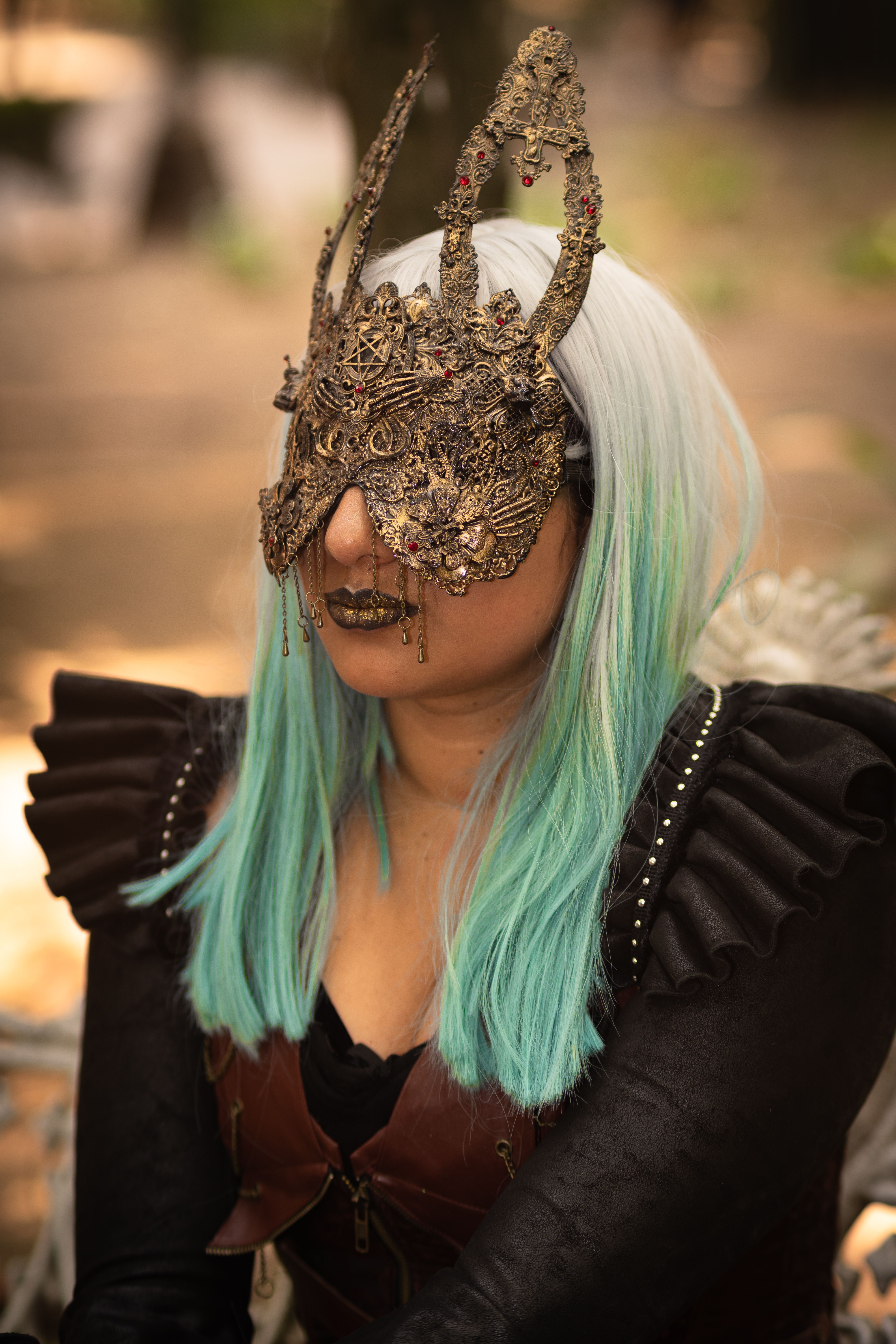 Woman in Blue and Gold Dress Wearing Gold and Black Mask  Free Stock Photo