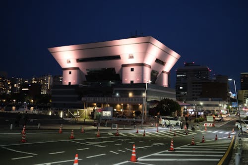 A large building with lights on at night