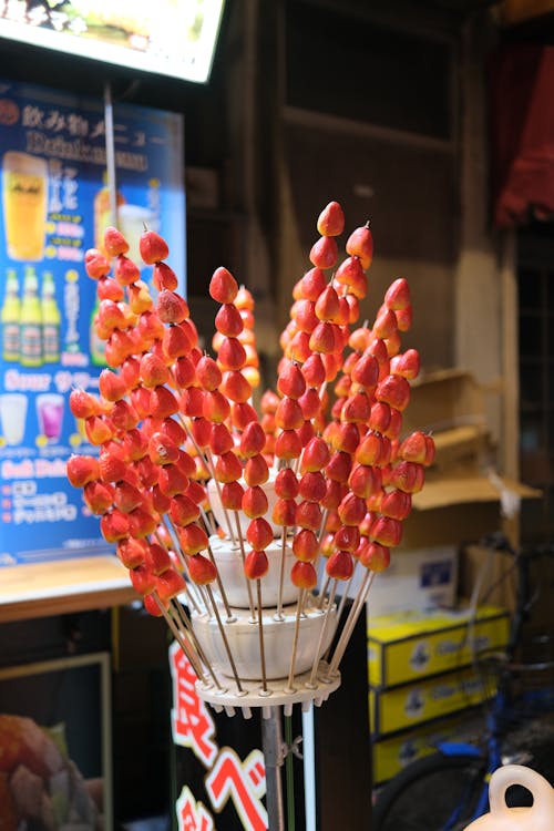 A bunch of red strawberries on a stick