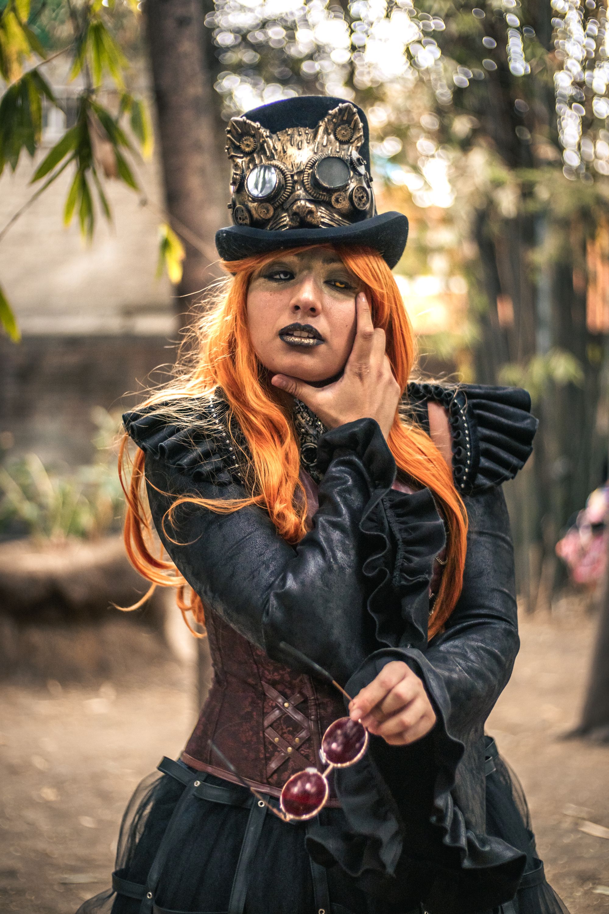 A woman in a steampunk costume with red hair · Free Stock Photo