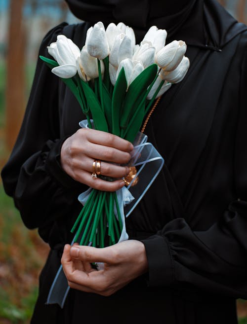 Close-up of Woman Holding a Bunch of White Tulips 