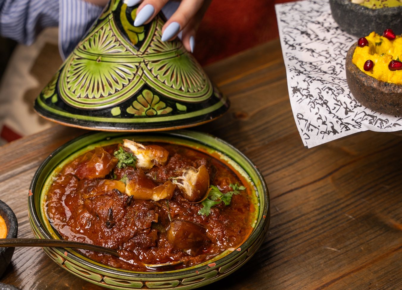 A variety of Moroccan dishes displayed on a traditional table
