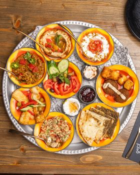 An overhead shot of a vibrant platter showcasing traditional Middle Eastern cuisine.
