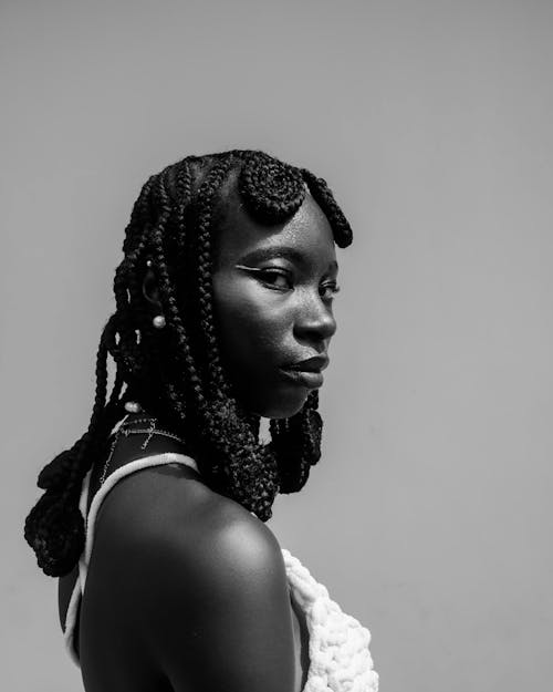A black woman with braids in her hair