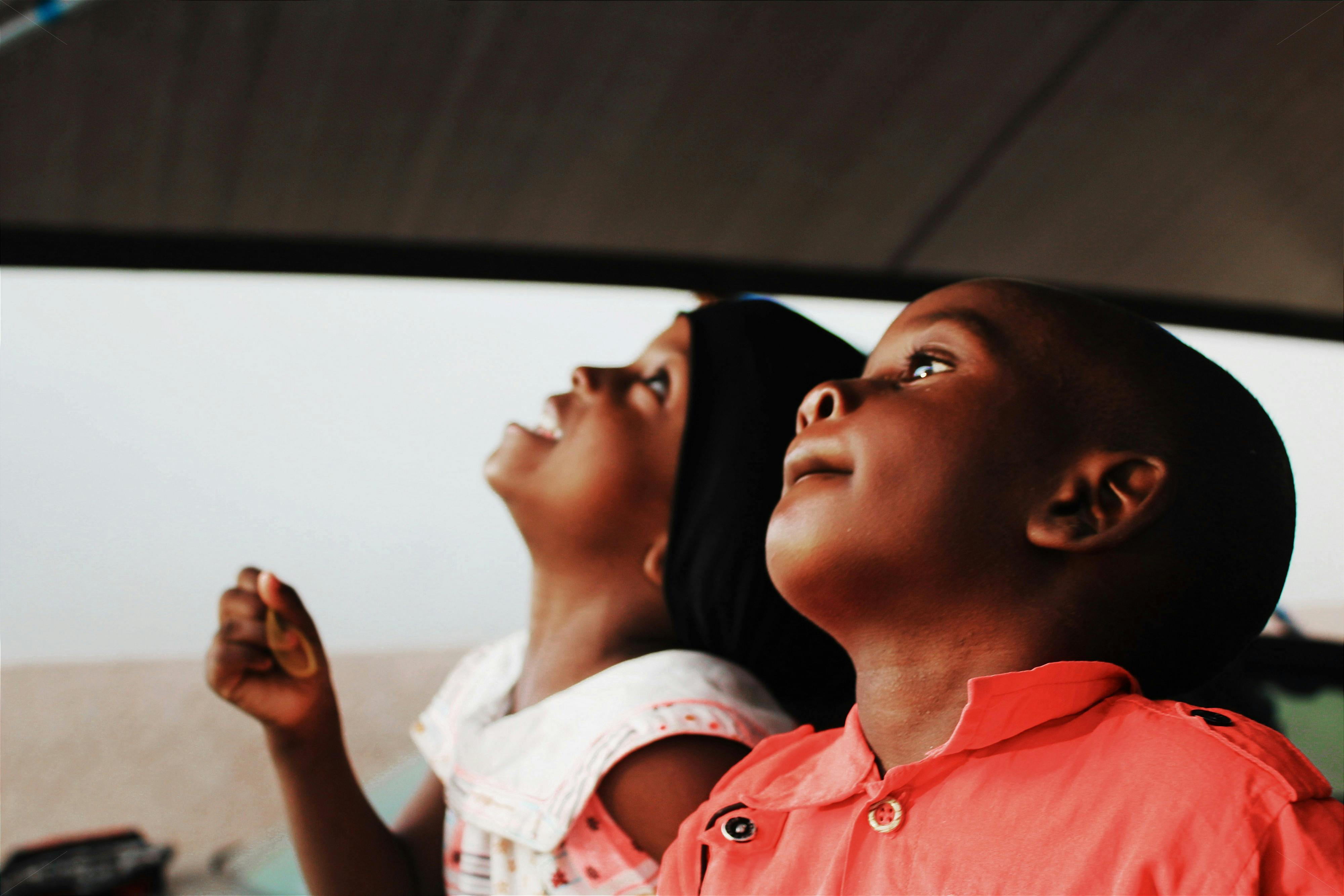 two children looking up