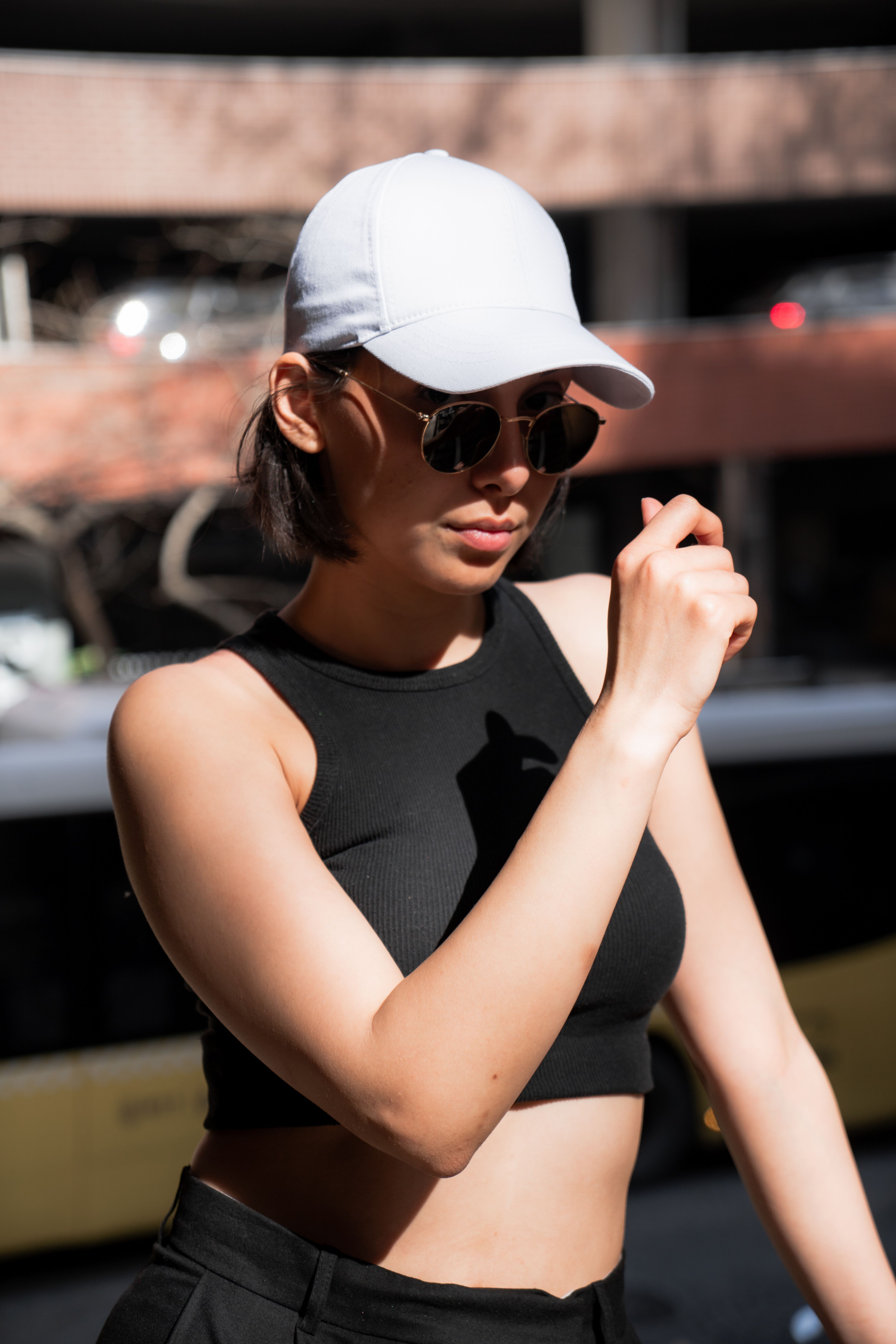 Woman in Sports Clothing, Sunglasses and Baseball Cap · Free Stock Photo