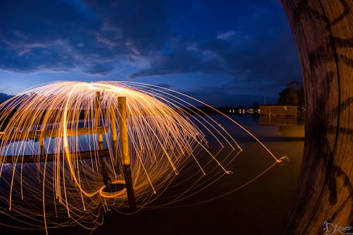 Firework Over Sea Pier at Dawn