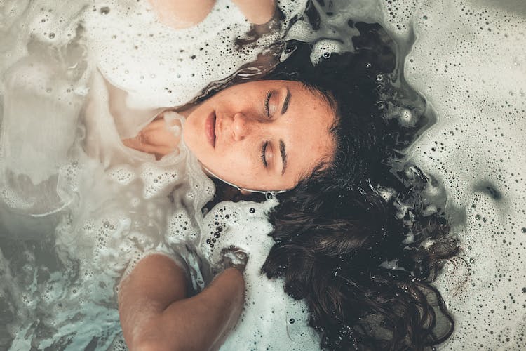 Woman Soaked In Water With Bubbles