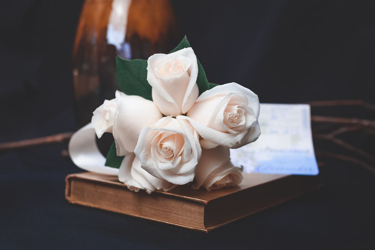 Elegant white rose bouquet tied with a silk ribbon