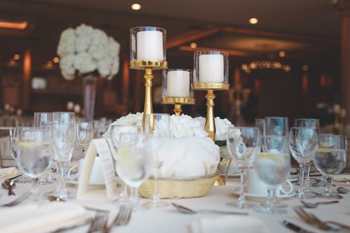 Free Luxurious table setting featuring candles and white roses, ideal for a banquet or fine dining experience. Stock Photo
