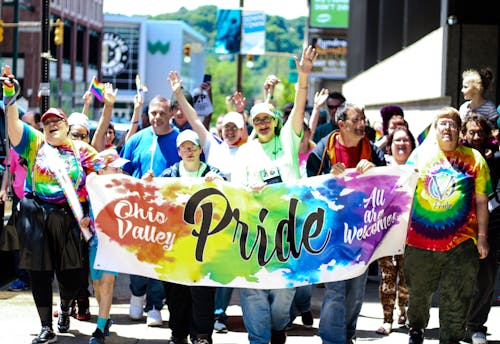 Free Group of People Parading in Street Stock Photo