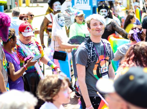 Free Joyful crowd celebrating diversity at a colorful pride parade outdoors. Stock Photo