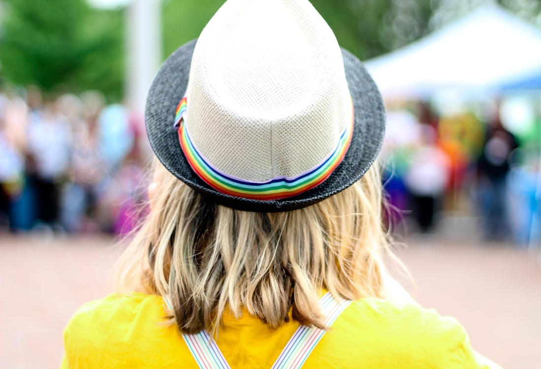 Free Woman in a Gray Fedora and Yellow Shirt Stock Photo