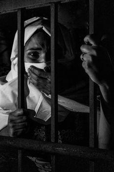 Grayscale Photography of Woman Inside Jail