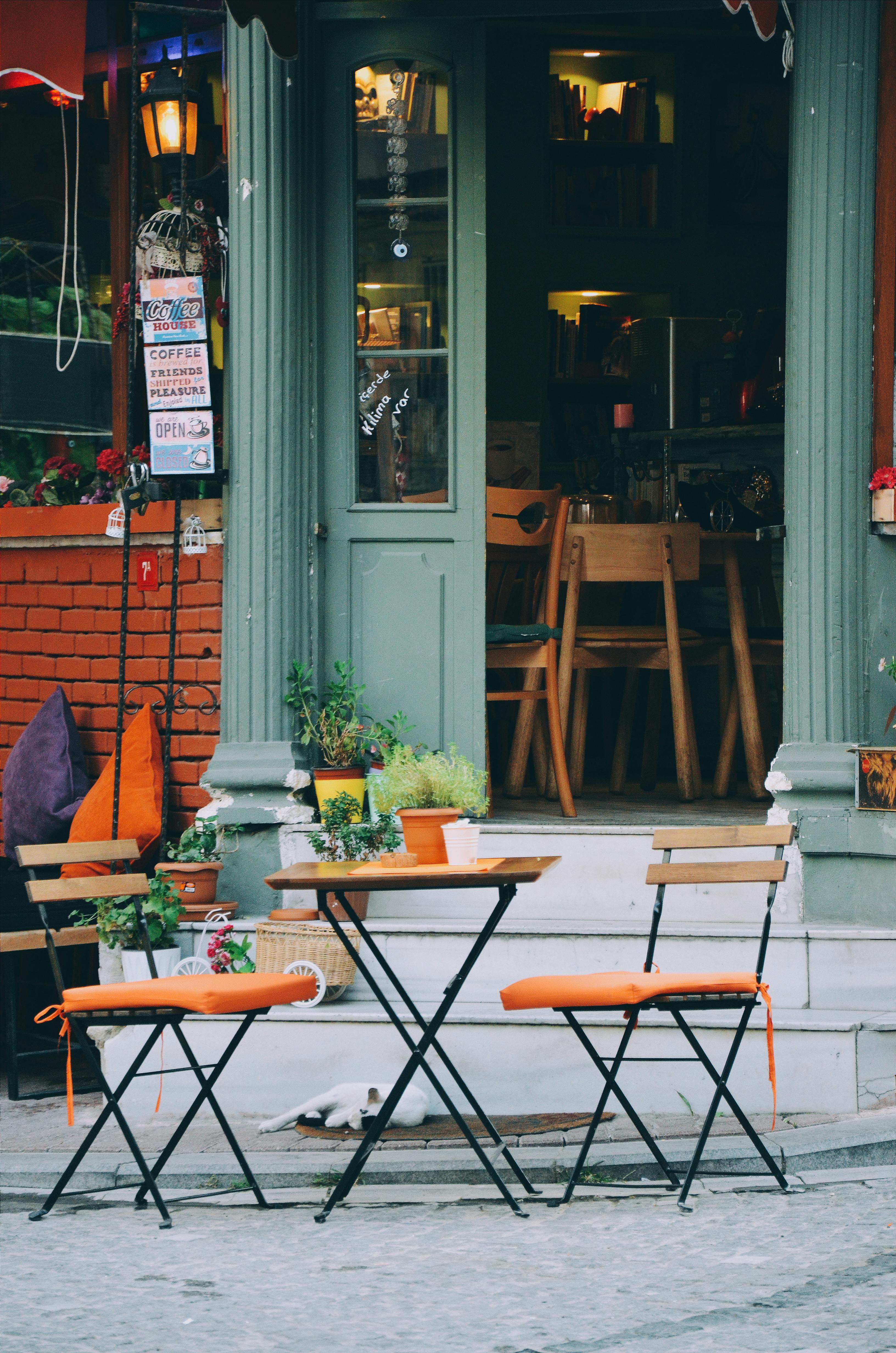Brown and Orange 3-piece Patio Set Outside A Coffee Shop · Free Stock Photo