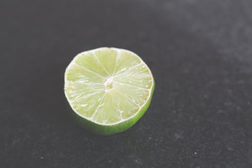 Sliced Lemon on Black Surface