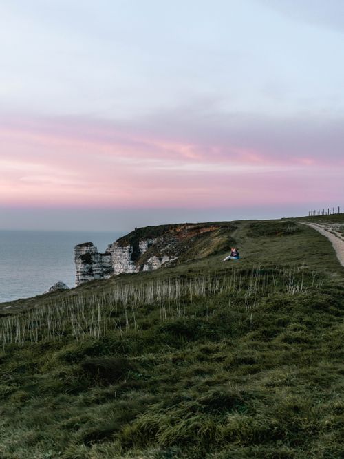 Free Experience the breathtaking sunset over the iconic cliffs at Étretat, Normandy. Perfect blend of nature and tranquility. Stock Photo