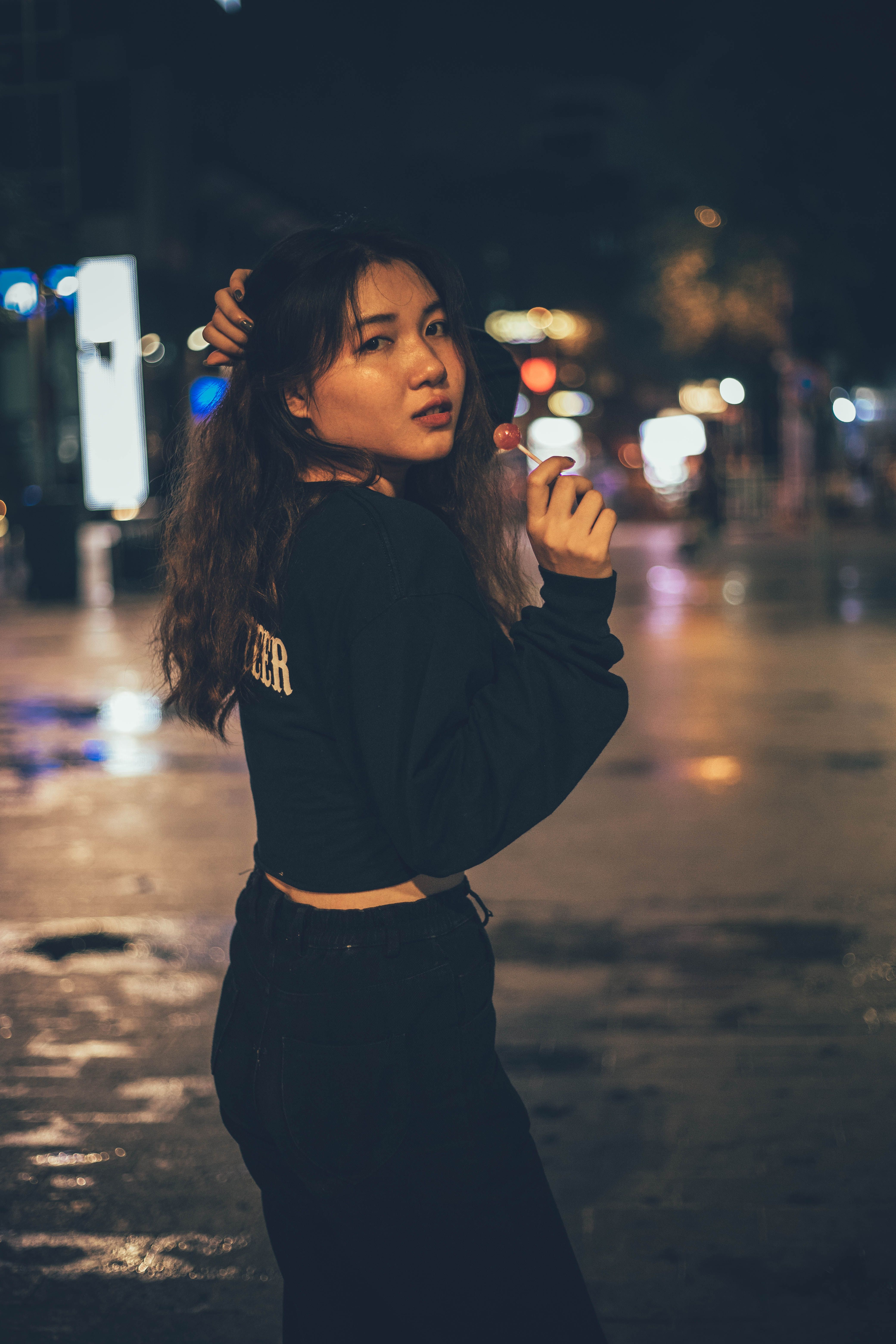 Young Woman Posing on Night City Street · Free Stock Photo