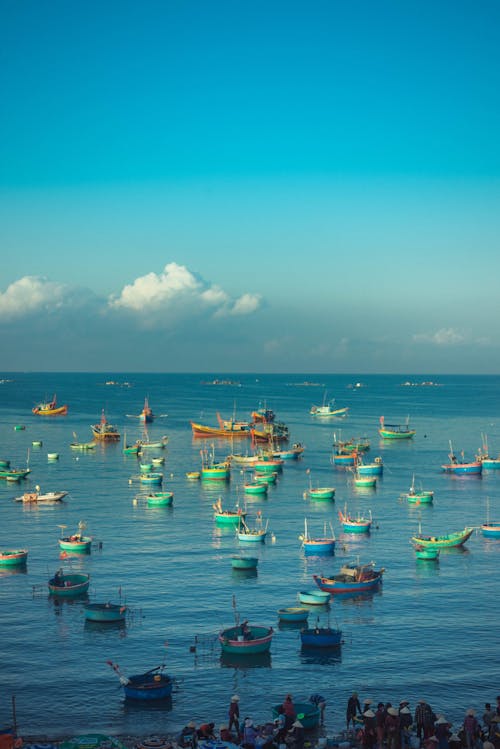 A large group of boats in the ocean