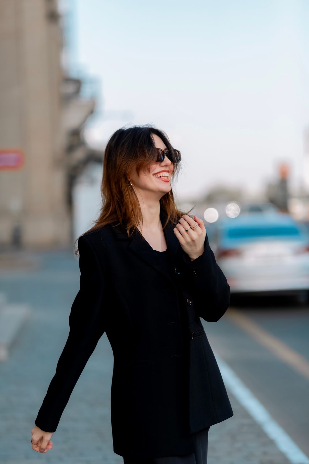 Smiling Woman in Sunglasses and Black Suit Jacket · Free Stock Photo