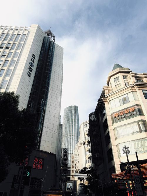 Free Modern skyscrapers in the bustling downtown of Tianjin, China. Stock Photo