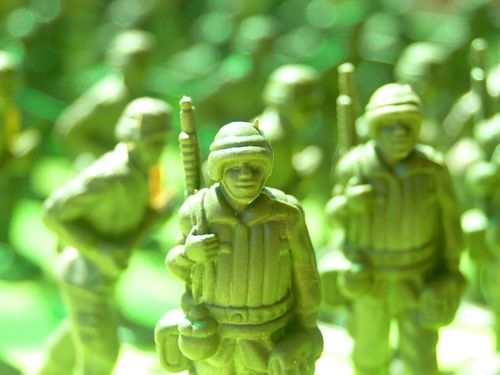 Free Detailed shot of green toy soldiers in uniform, ideal for military-themed projects. Stock Photo