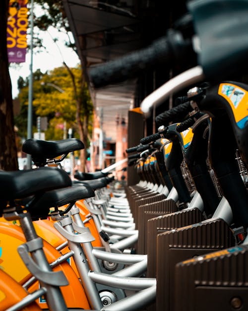 Photo of Gray and Yellow Bikes on Parking Lot