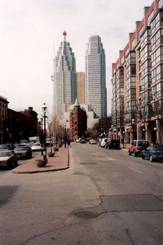 Urban street view of Toronto's skyscrapers, featuring iconic architecture on a quiet day.