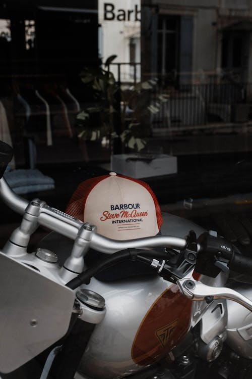 A motorcycle parked in front of a shop window