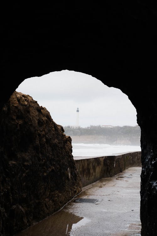 A view of the ocean from a tunnel