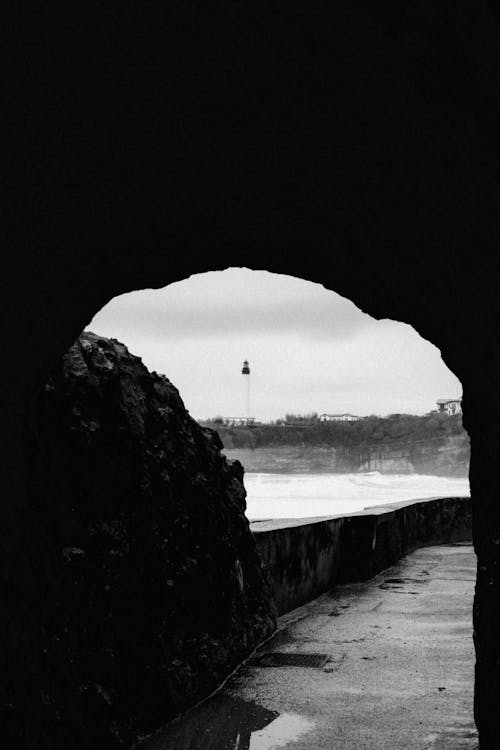 A black and white photo of a lighthouse