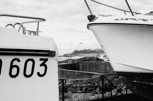 A black and white photo of a boat with a number on it