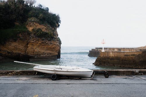 A boat is parked on the side of the road