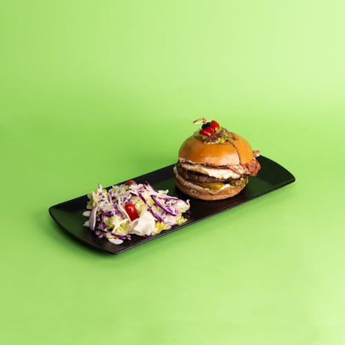 A burger and coleslaw on a plate