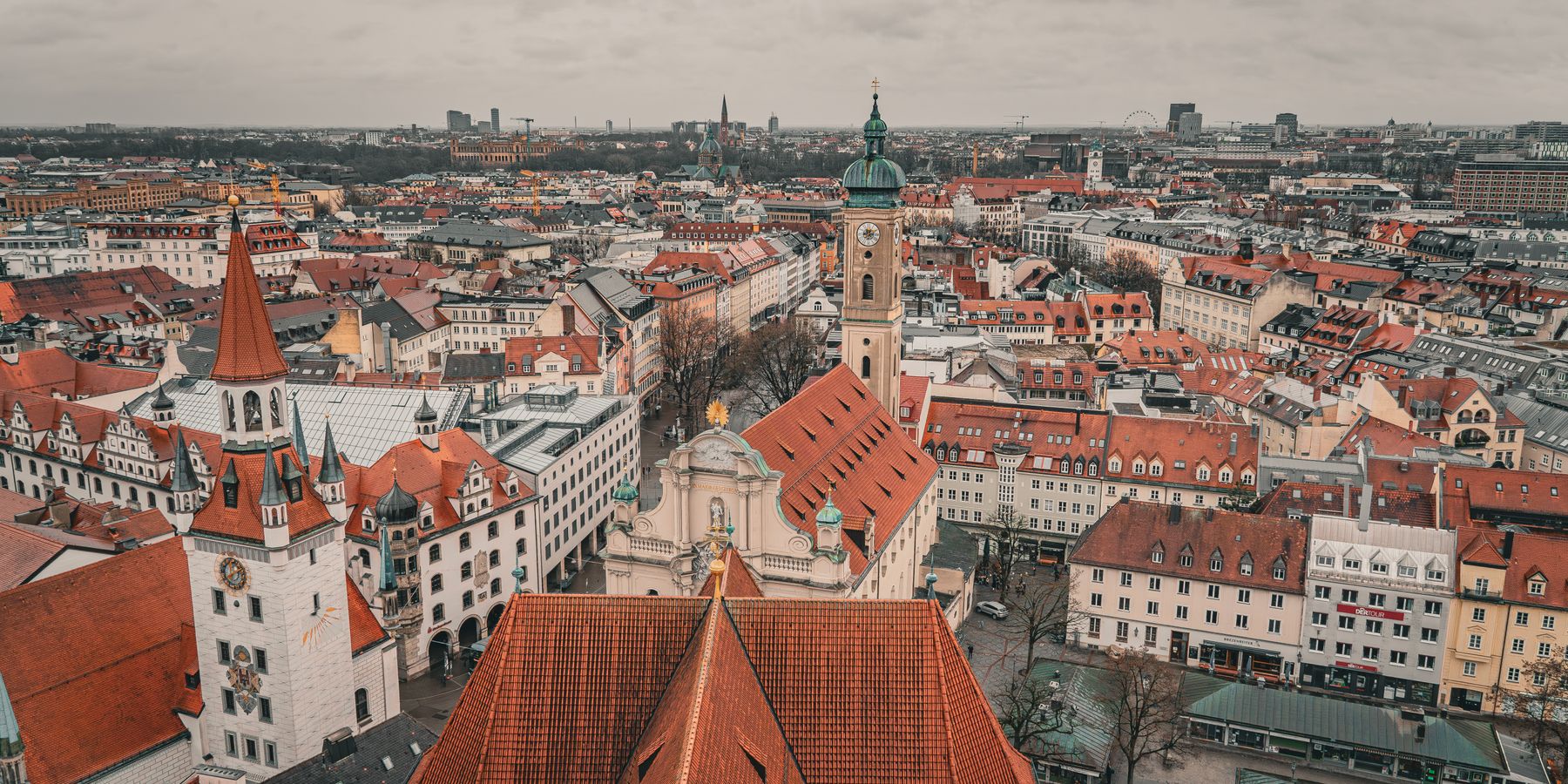 Aerial photo showcasing the historic architecture and vibrant rooftops of Munich's old town.