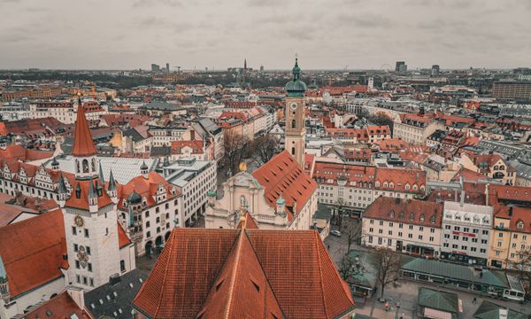 Aerial photo showcasing the historic architecture and vibrant rooftops of Munich's old town.