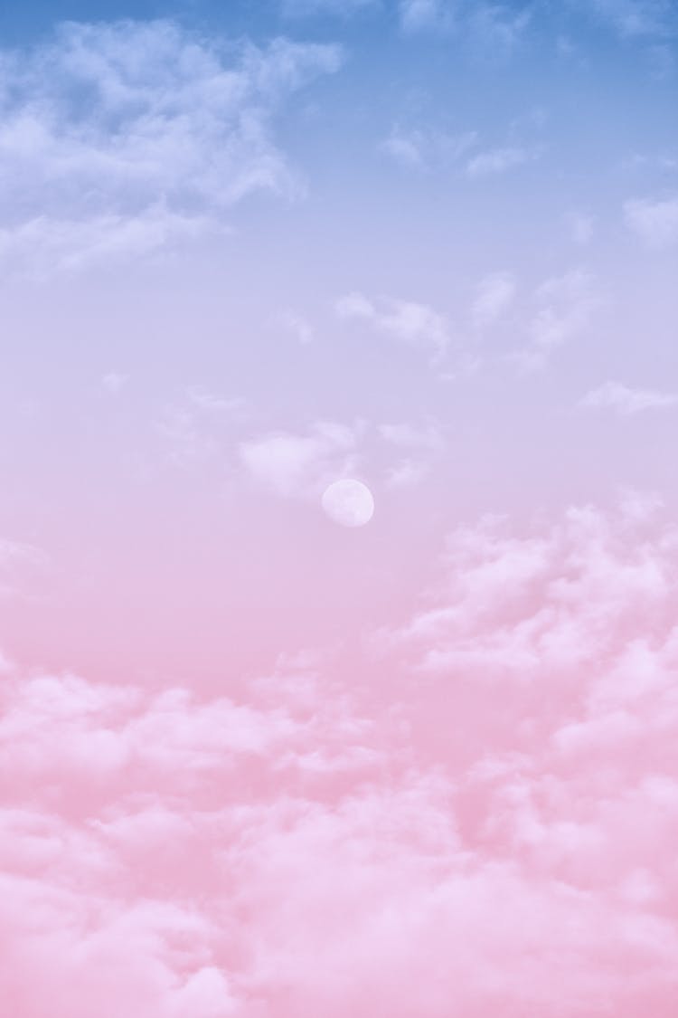 White Clouds In Pink And Blue Clouds