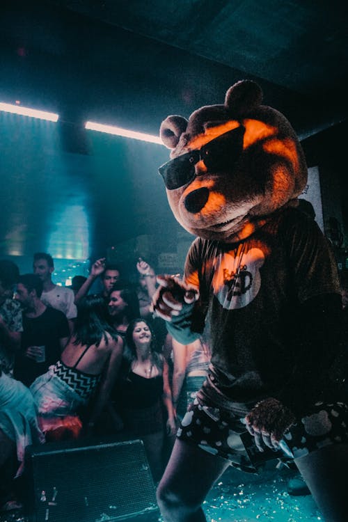 Free Person Wearing Bear Mask Dancing on Stage Stock Photo